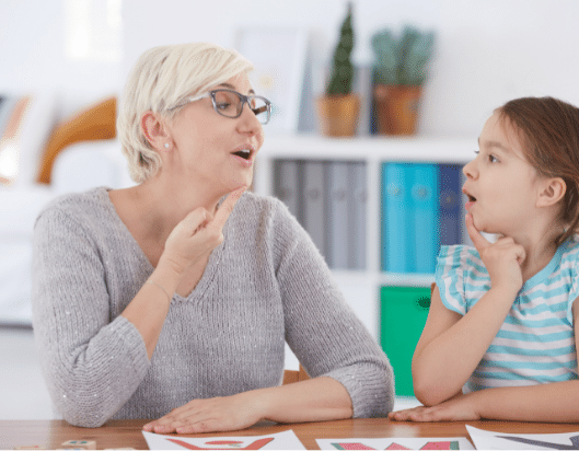 Young girl learning how to speak