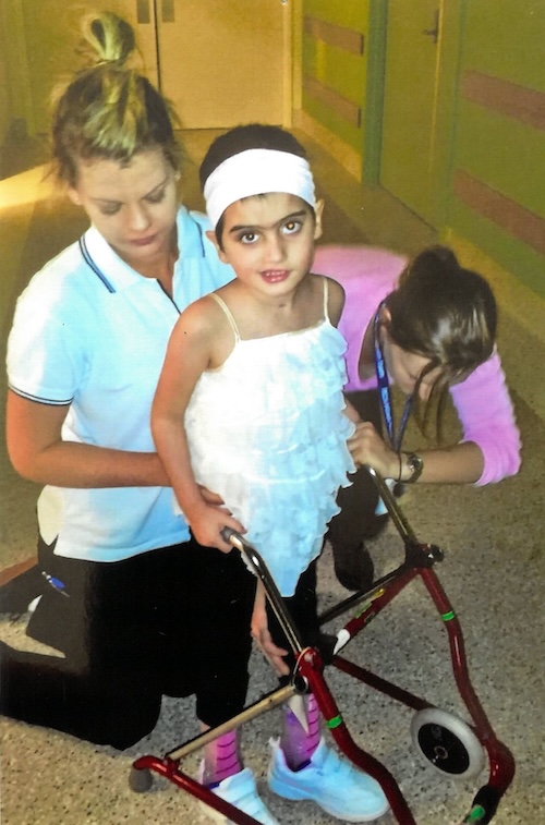 Brain injury patient Chelsea learning to use her walker