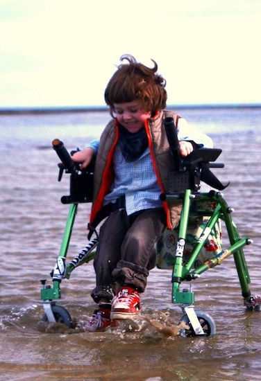 Cerebral palsy patient Cooper using his wheelchair from childhood