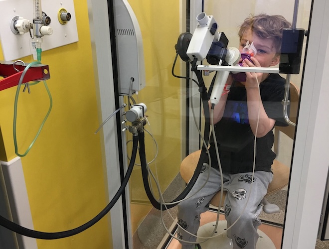 Lewis taking part in a lung function exercise