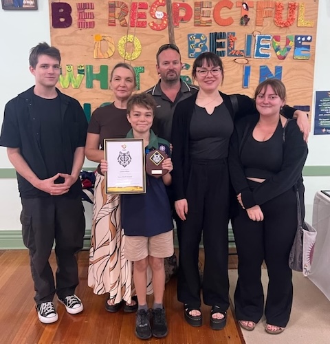 Lewis and his family at a scouts presentation