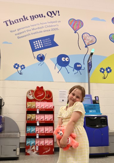 Emily in front of the Big W Christmas mural