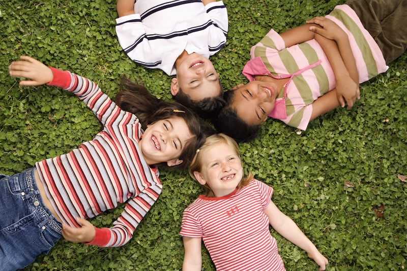 children laying on the ground