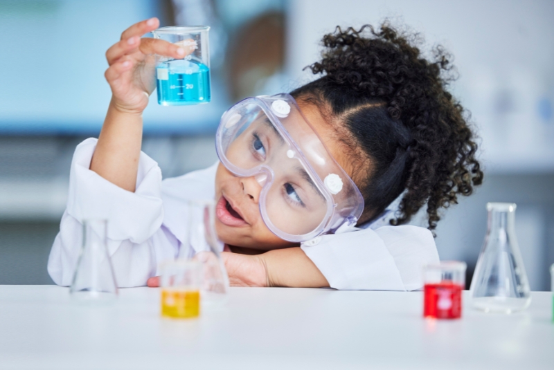 child doing science experiment
