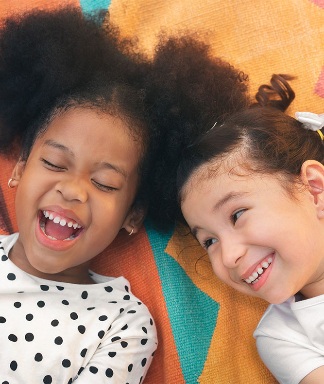 Two girls laughing