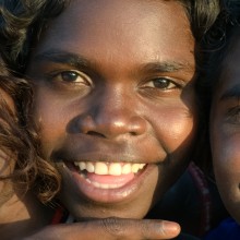 Three children smiling