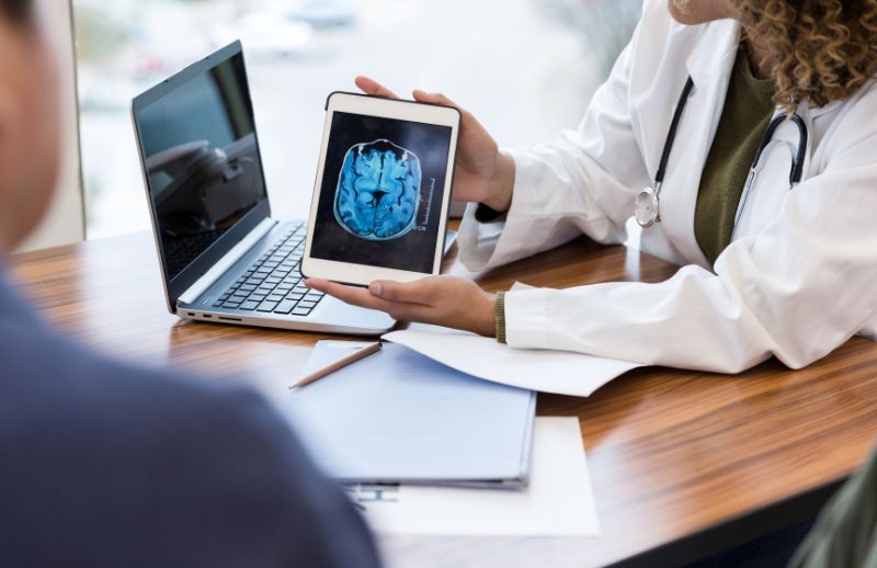 Doctor sharing scans with patient