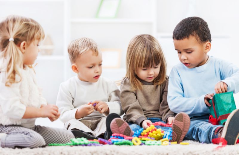 Toddlers playing with toys