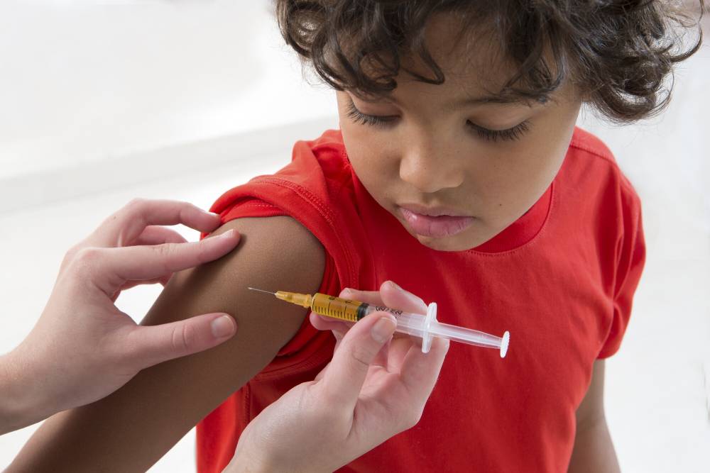 child getting vaccine