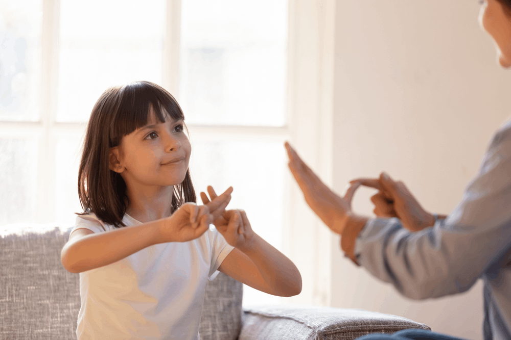 Girl learning sign language