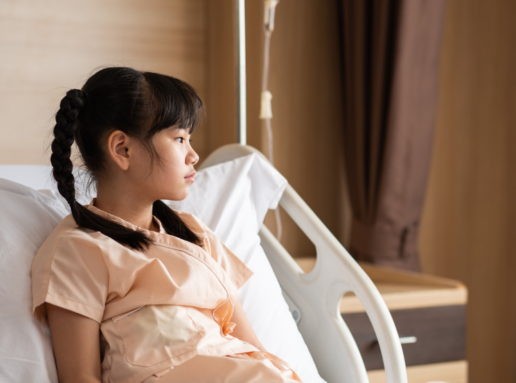 Child in hospital bed