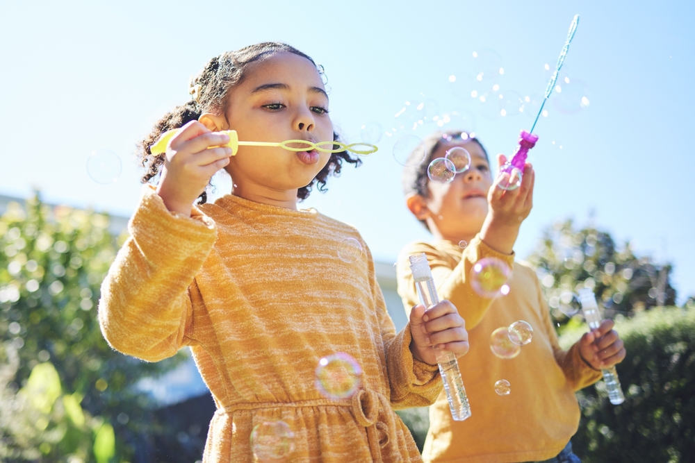 Children blowing bubbles