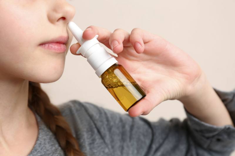 child using nasal spray