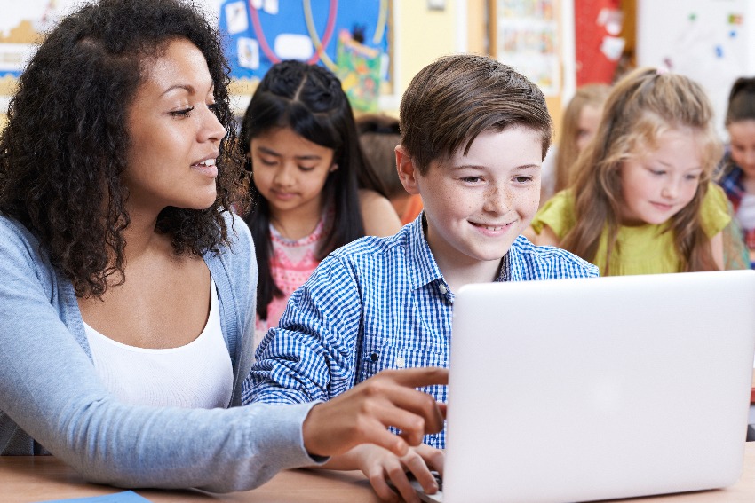 Children working on a laptop