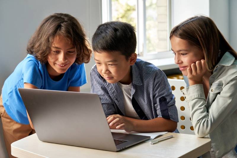 Children doing research on computer