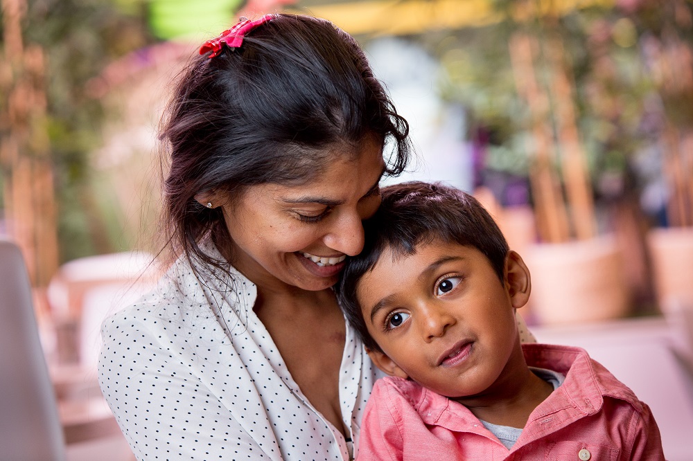 Mother hugging child