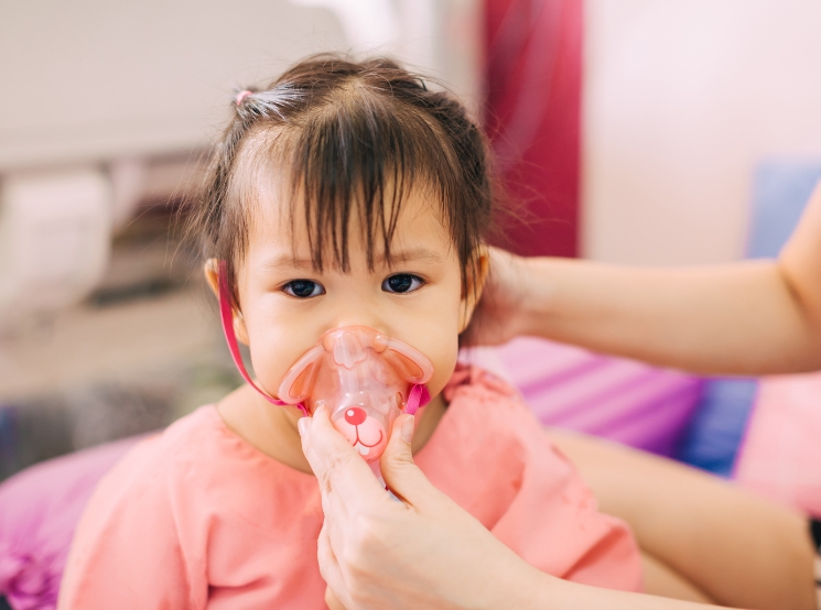 A child using a respiratory device