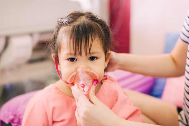 A child using a respiratory device