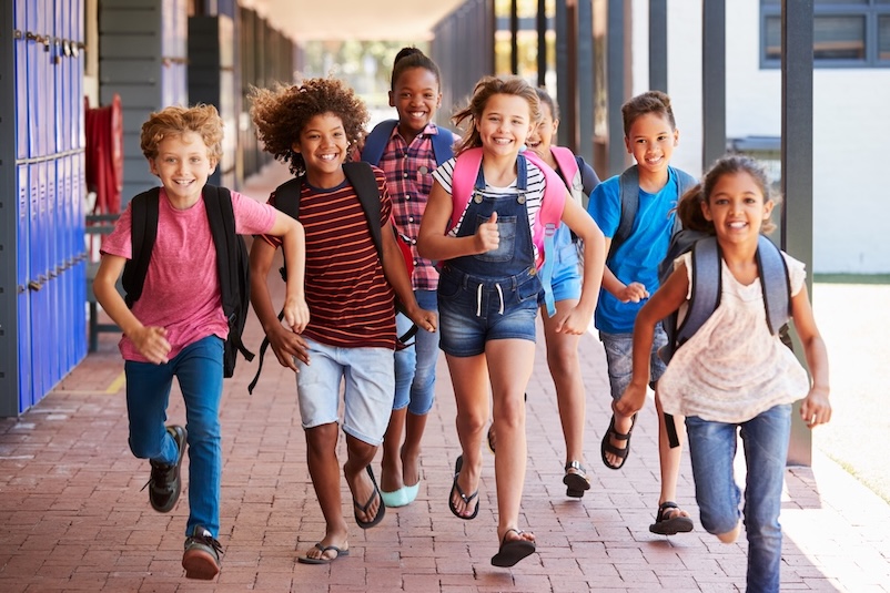 A group of children running happily