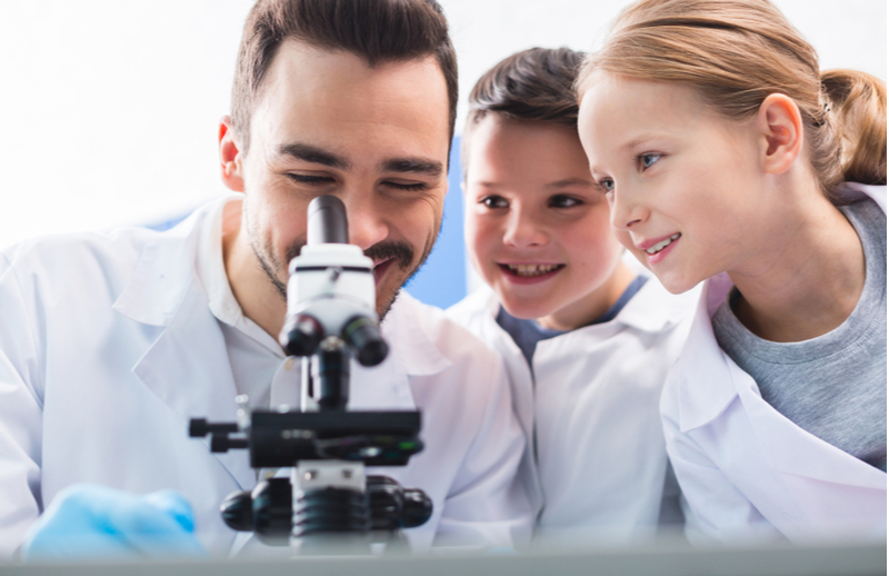 scientist with kids in lab
