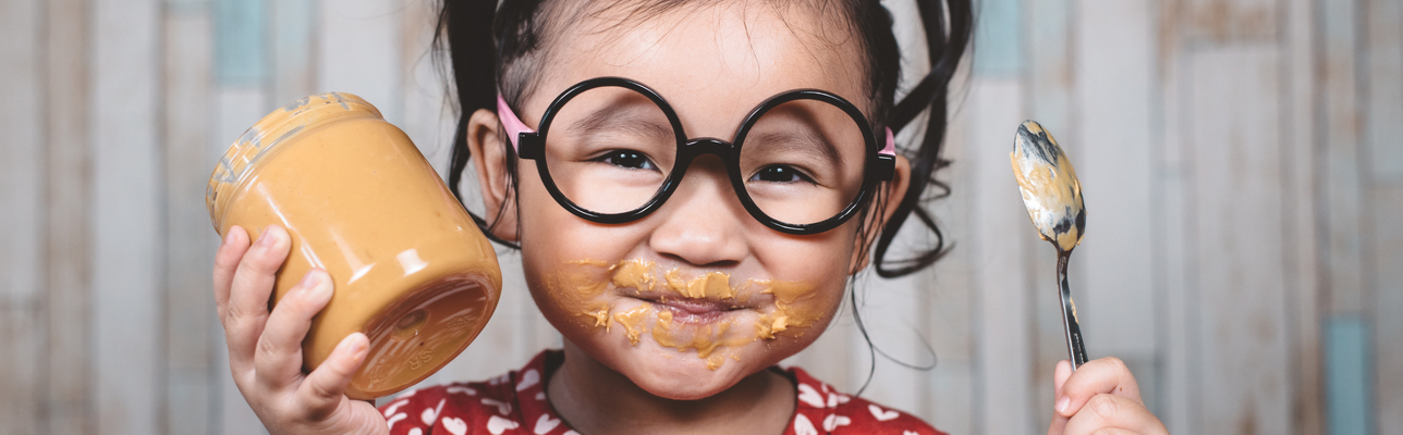Banner - girl eating peanut butter