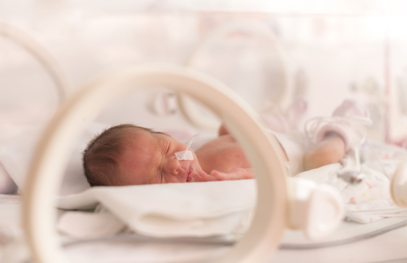 child in humidicrib