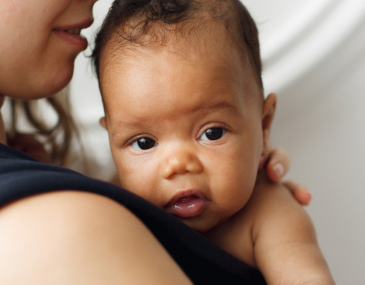 infant held by parent