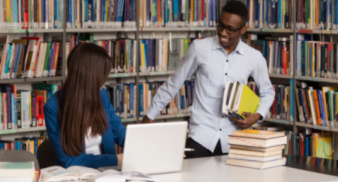 Masters students in a library
