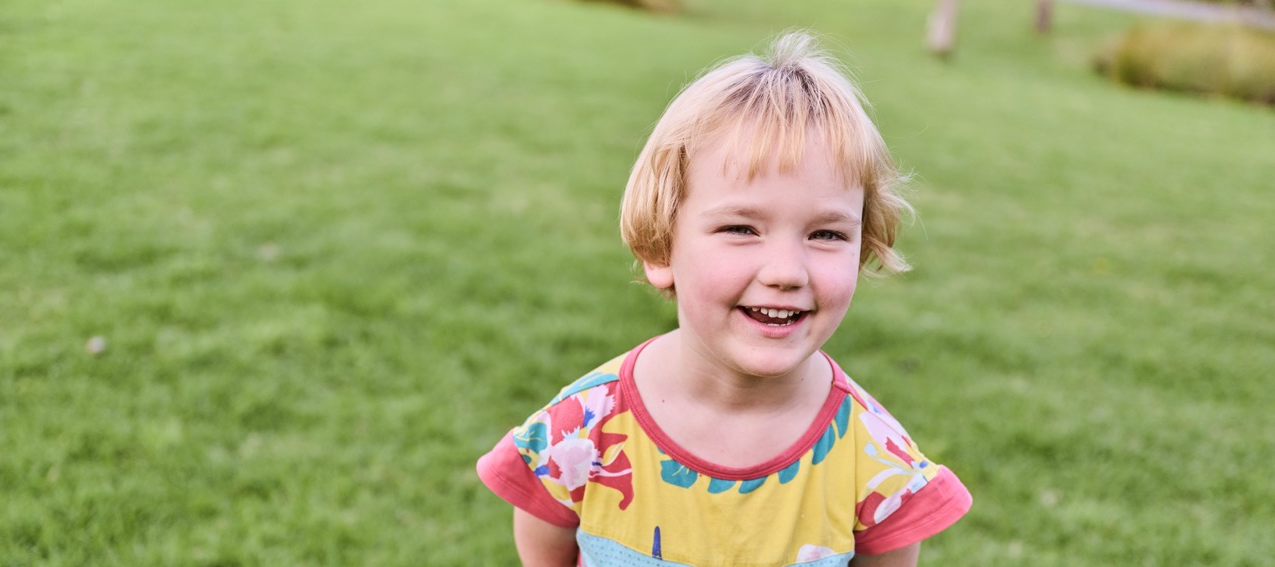 Child smiling at camera