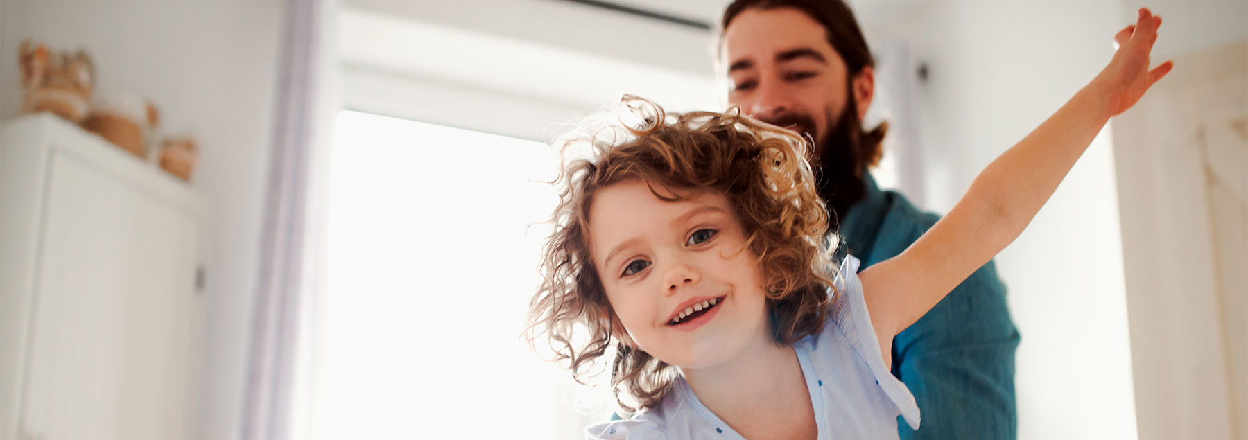 child and parent playing