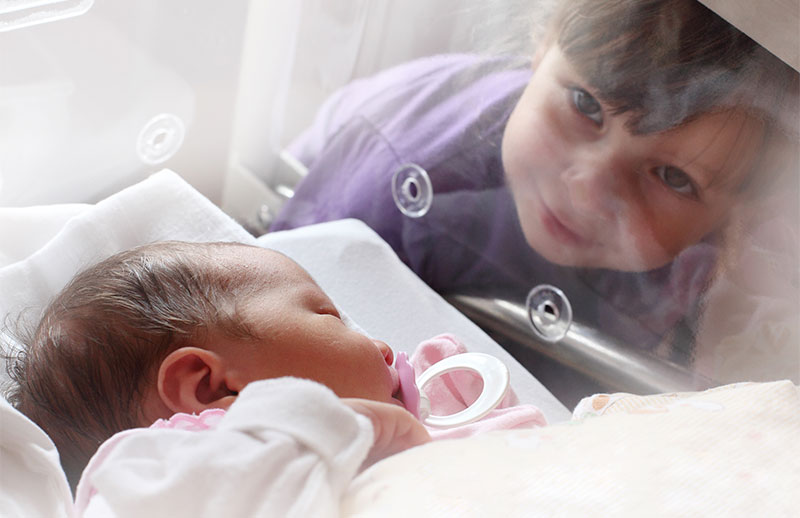baby in ICU with child